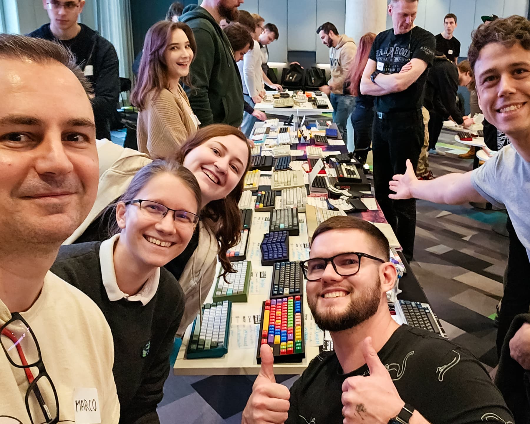 Selfie of a group of people with keyboards.