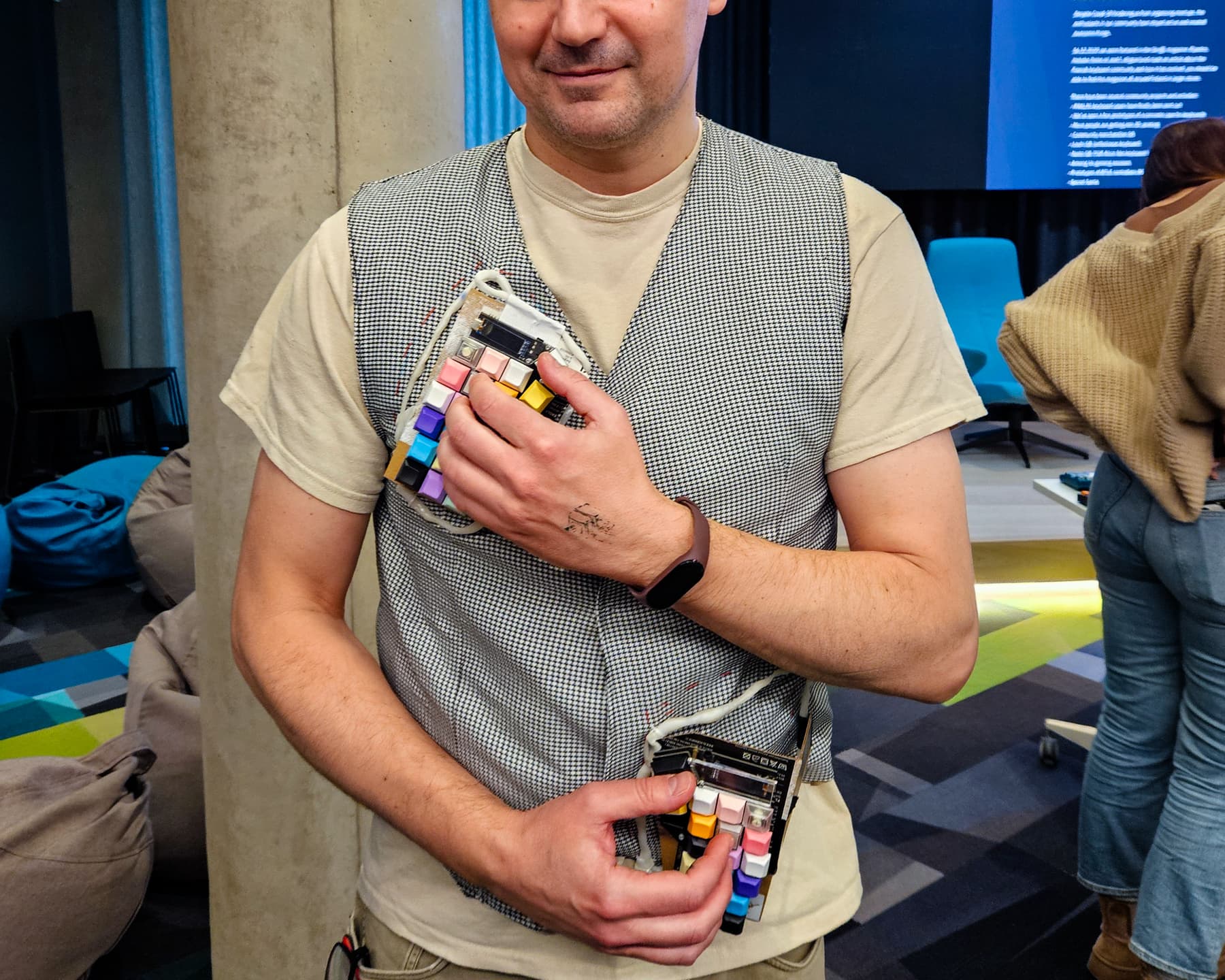 Person trying on the keyboard vest.