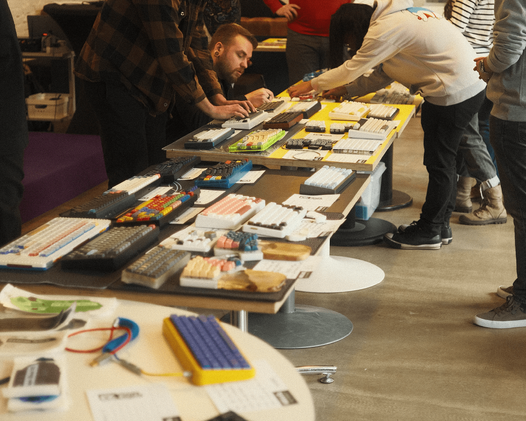 Third meetup, people around keyboard table