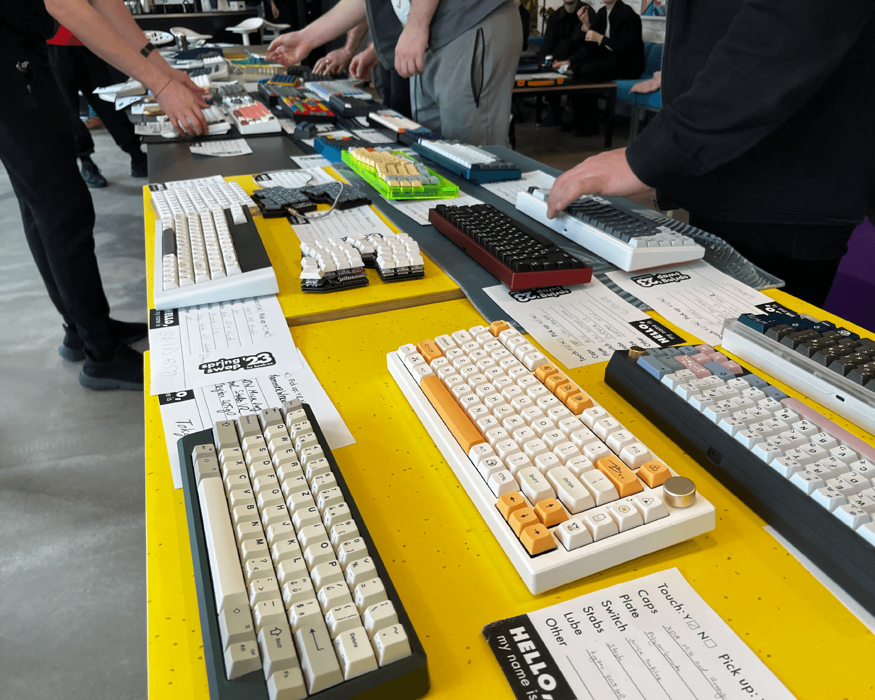 Third meetup, people positioning the keyboards on the table